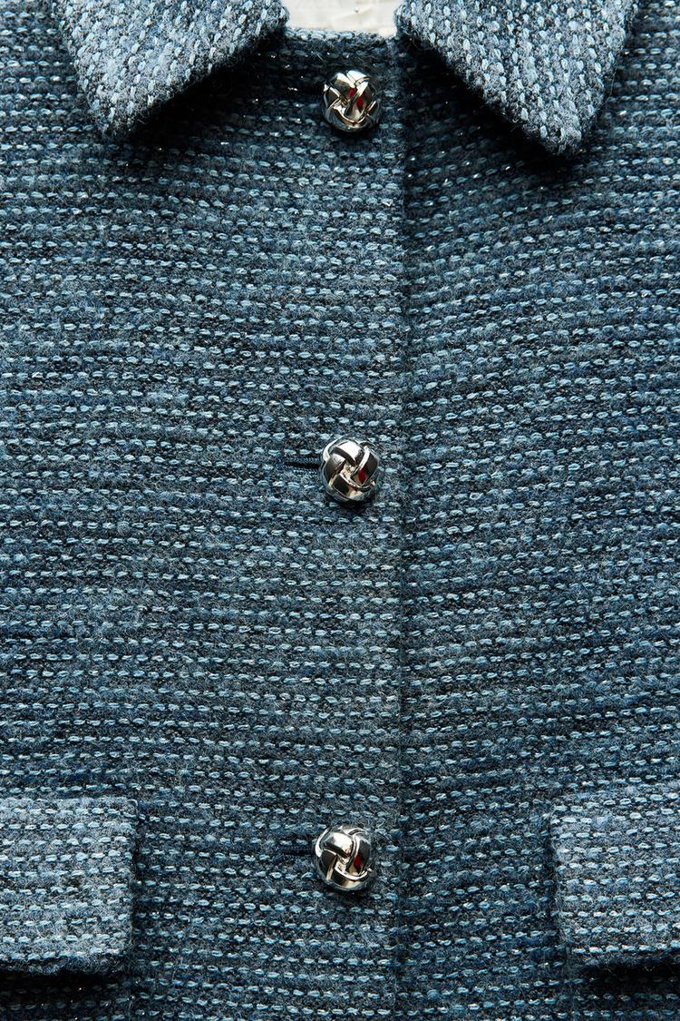 VESTE COURTE BOUCLÉE