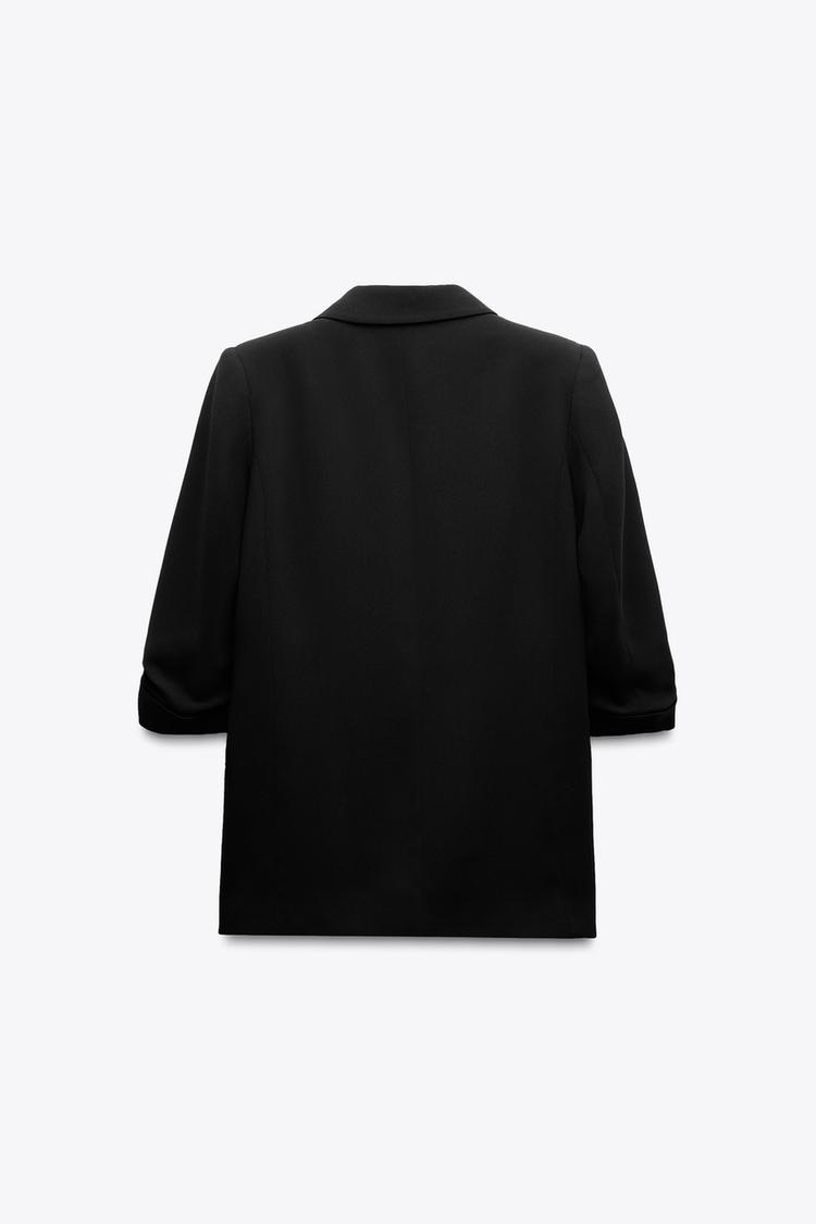 VESTE À MANCHES RETROUSSÉES