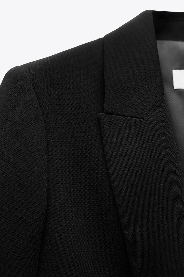 VESTE À MANCHES RETROUSSÉES