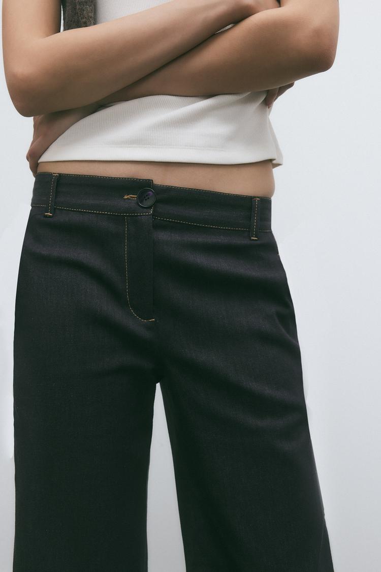 PANTALON BOOTCUT AVEC SURPIQÛRES EN MATIÈRES VARIÉES