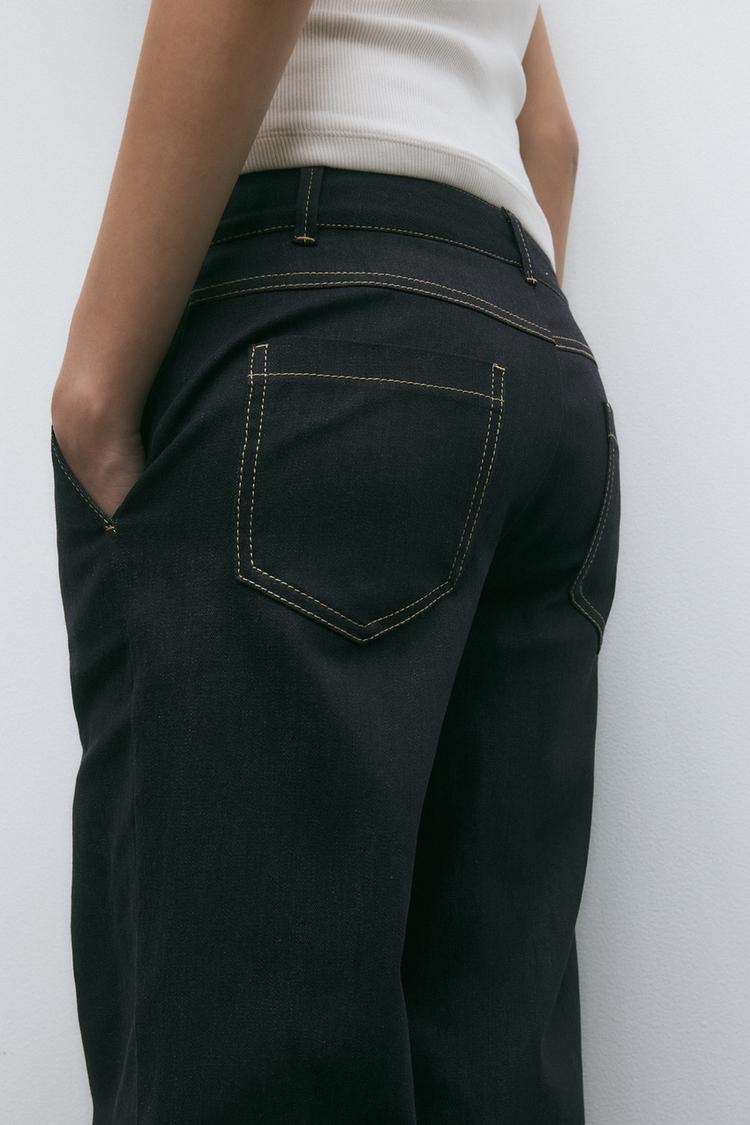 PANTALON BOOTCUT AVEC SURPIQÛRES EN MATIÈRES VARIÉES