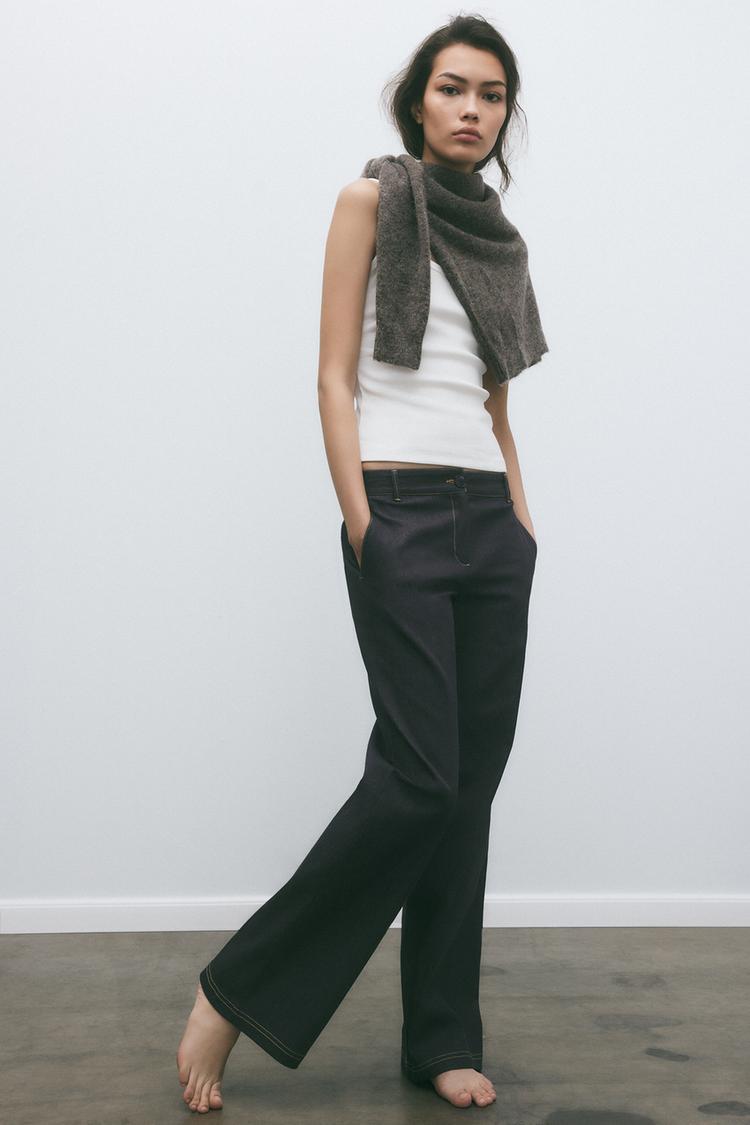 PANTALON BOOTCUT AVEC SURPIQÛRES EN MATIÈRES VARIÉES