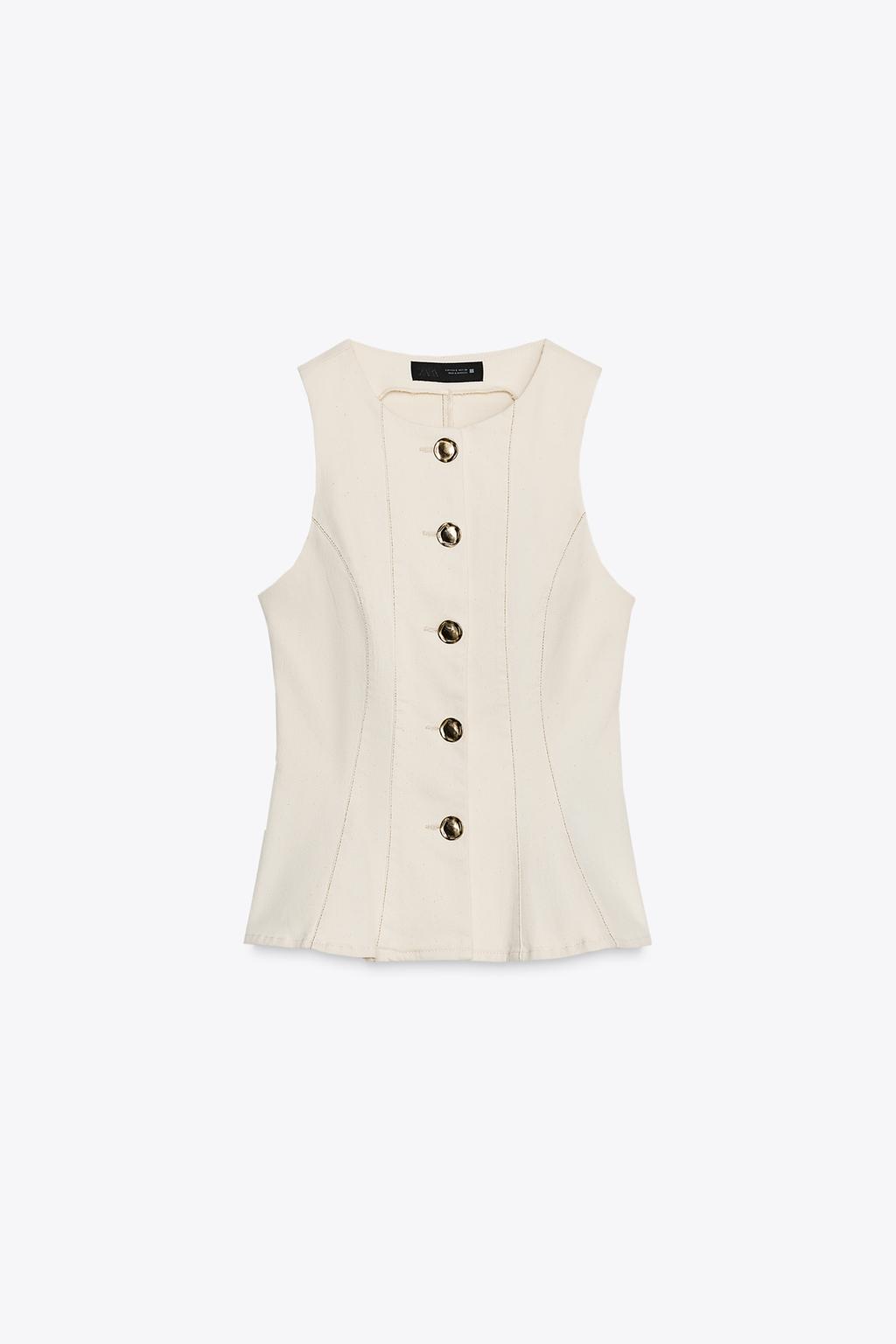 GILET PEPLUM SURPIQÛRES
