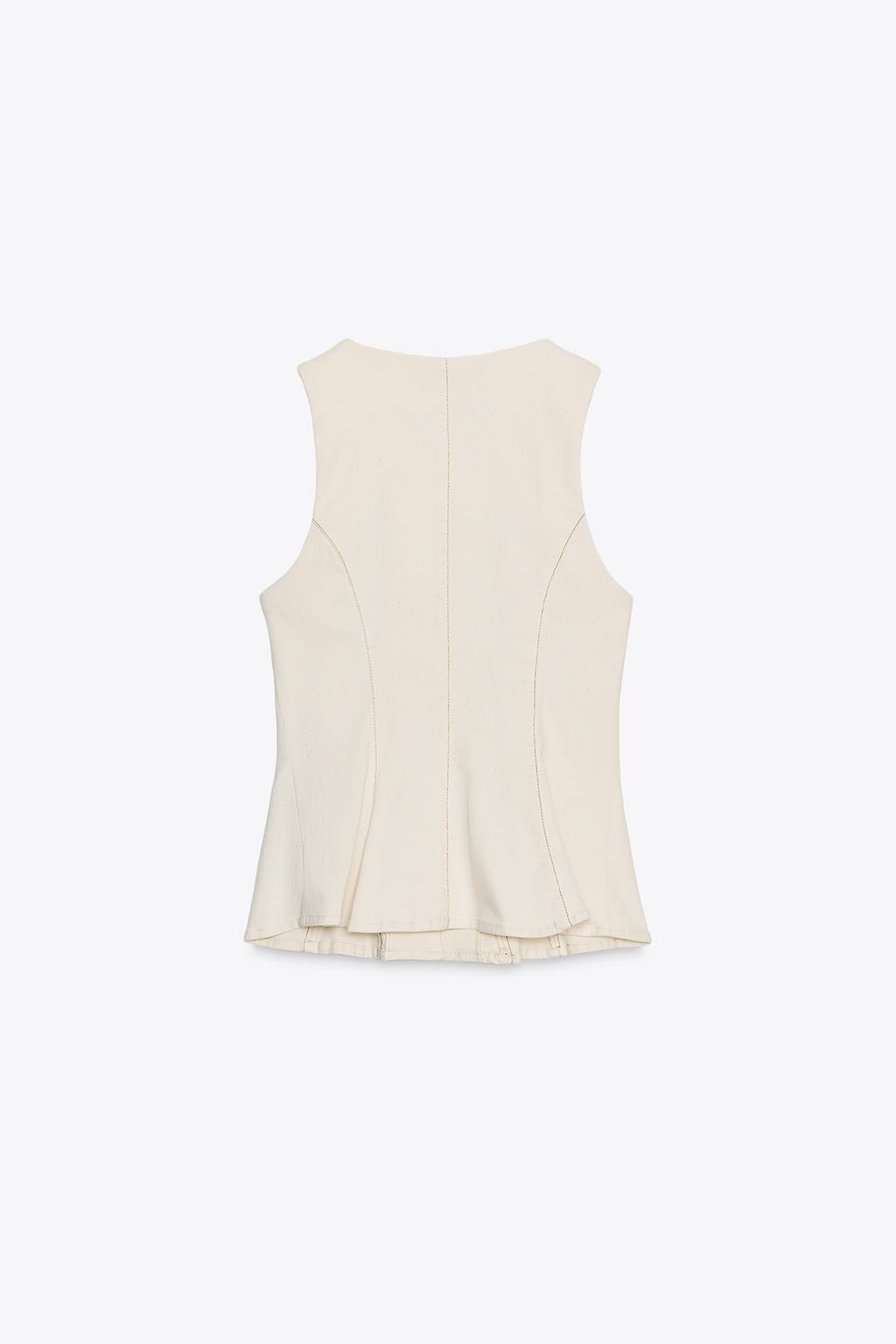 GILET PEPLUM SURPIQÛRES