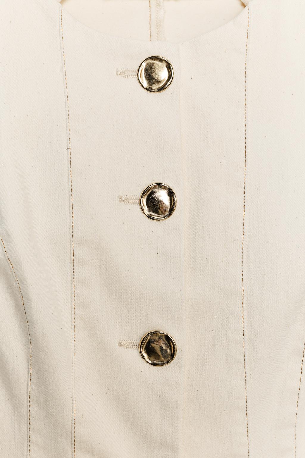 GILET PEPLUM SURPIQÛRES