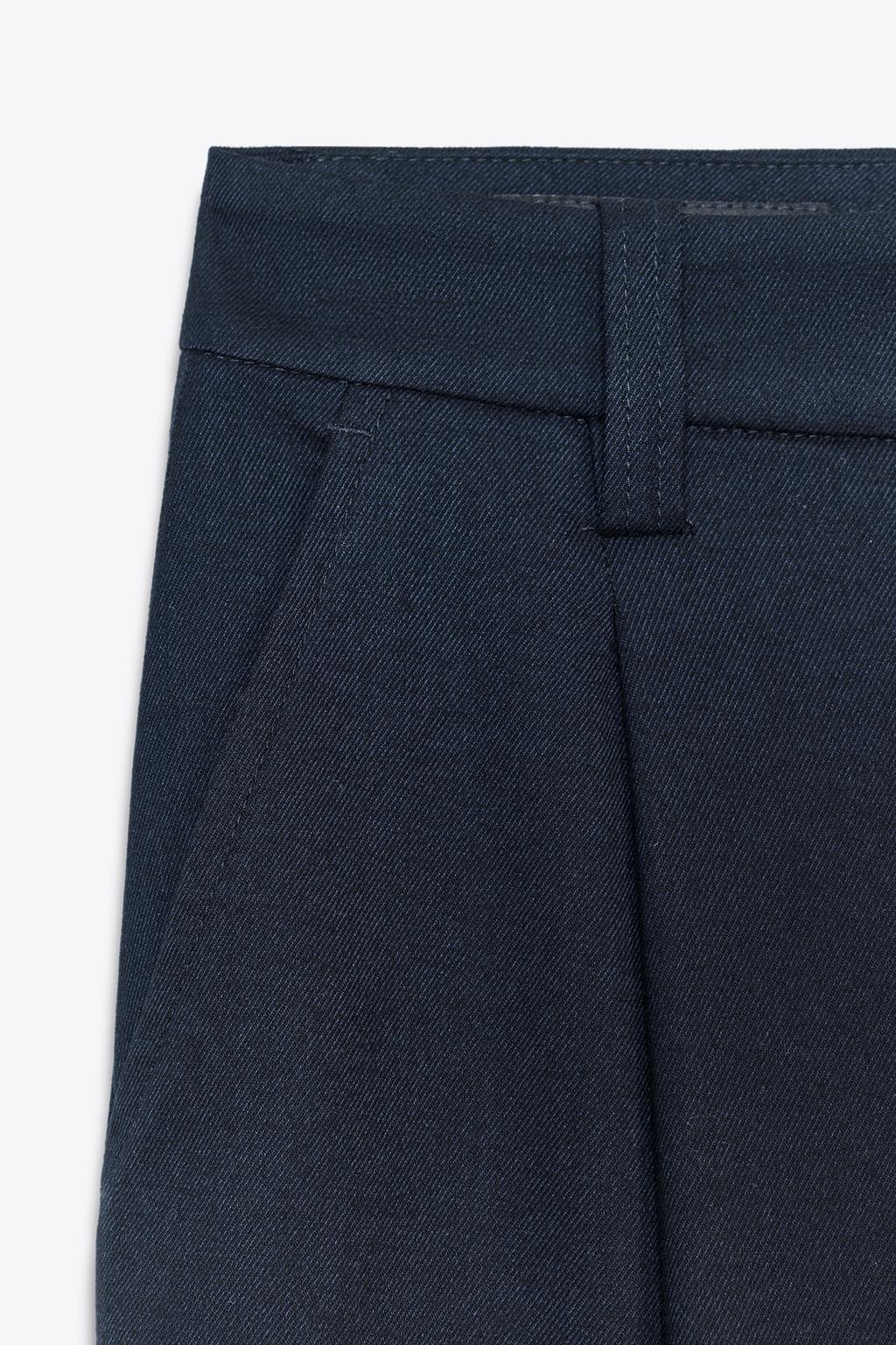 PANTALON À PINCES BAS BOUTON