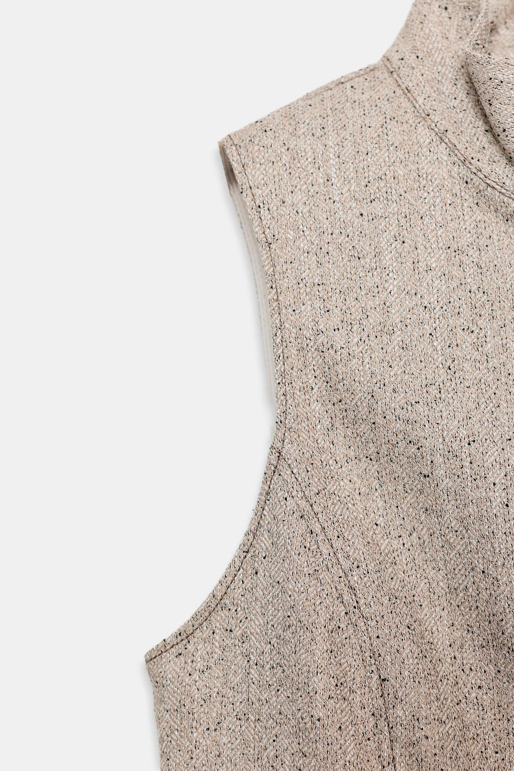 TOP SANS MANCHES À COL MONTANT