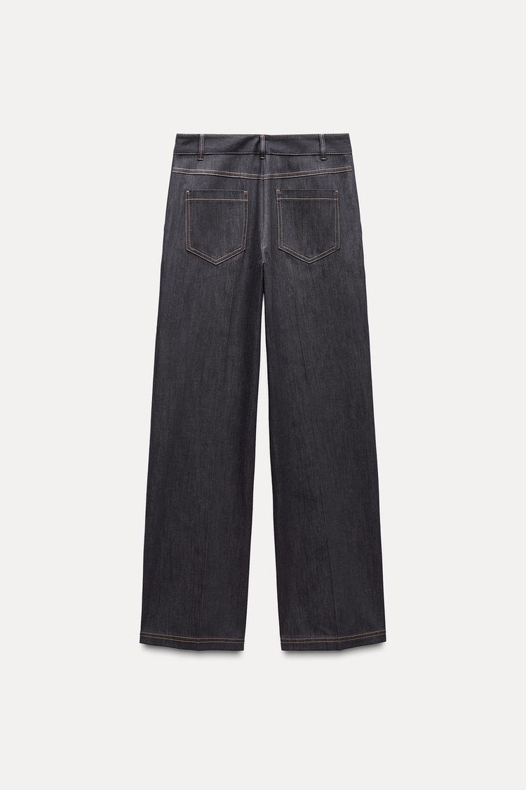 PANTALON BOOTCUT AVEC SURPIQÛRES EN MATIÈRES VARIÉES