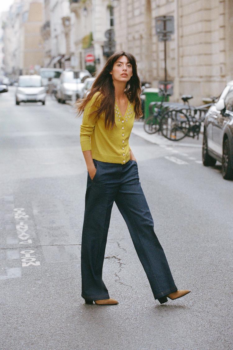 PANTALON BOOTCUT AVEC SURPIQÛRES EN MATIÈRES VARIÉES