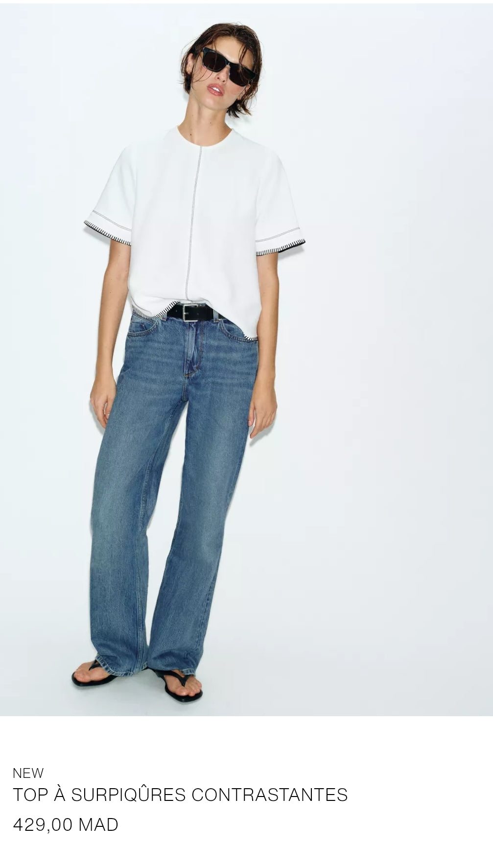 TOP À SURPIQÛRES CONTRASTANTES