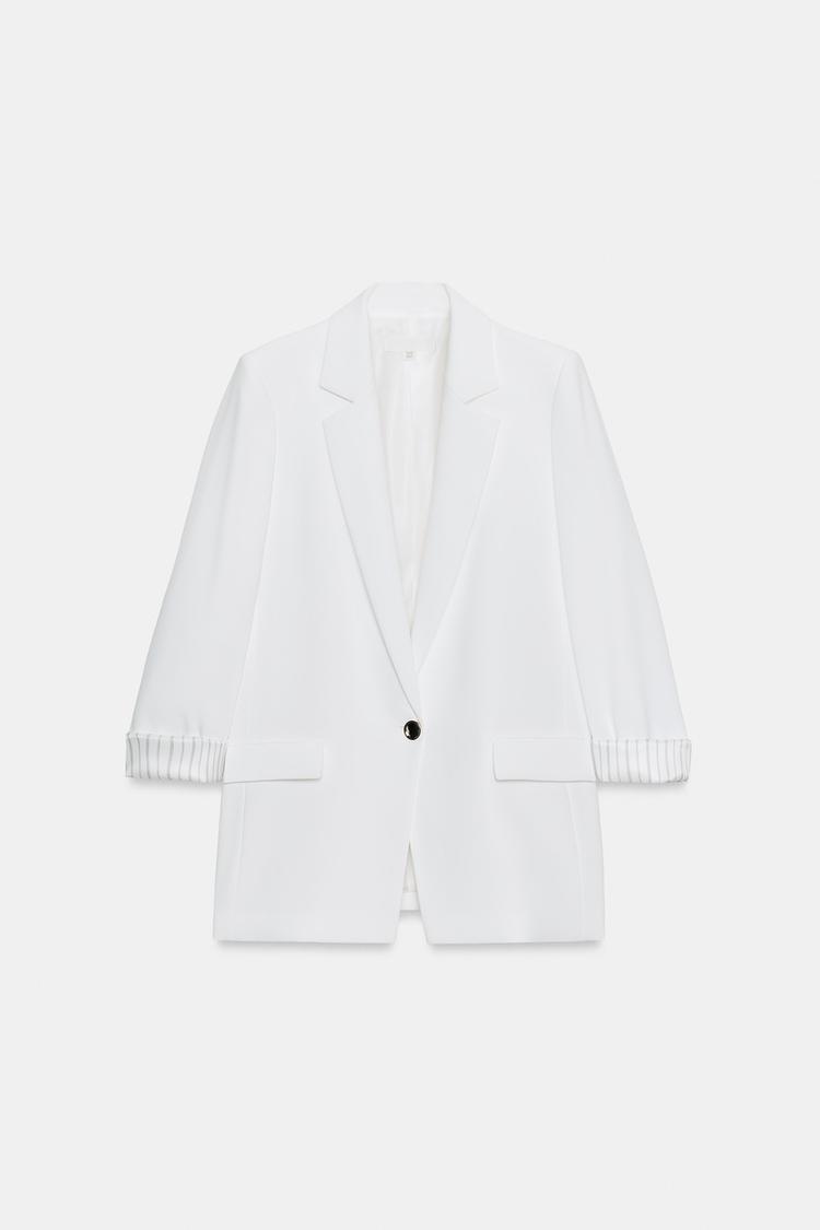 VESTE À MANCHES RETROUSSÉES ET POIGNETS IMPRIMÉS