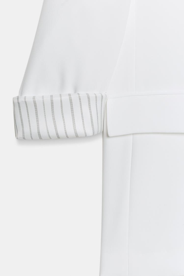 VESTE À MANCHES RETROUSSÉES ET POIGNETS IMPRIMÉS
