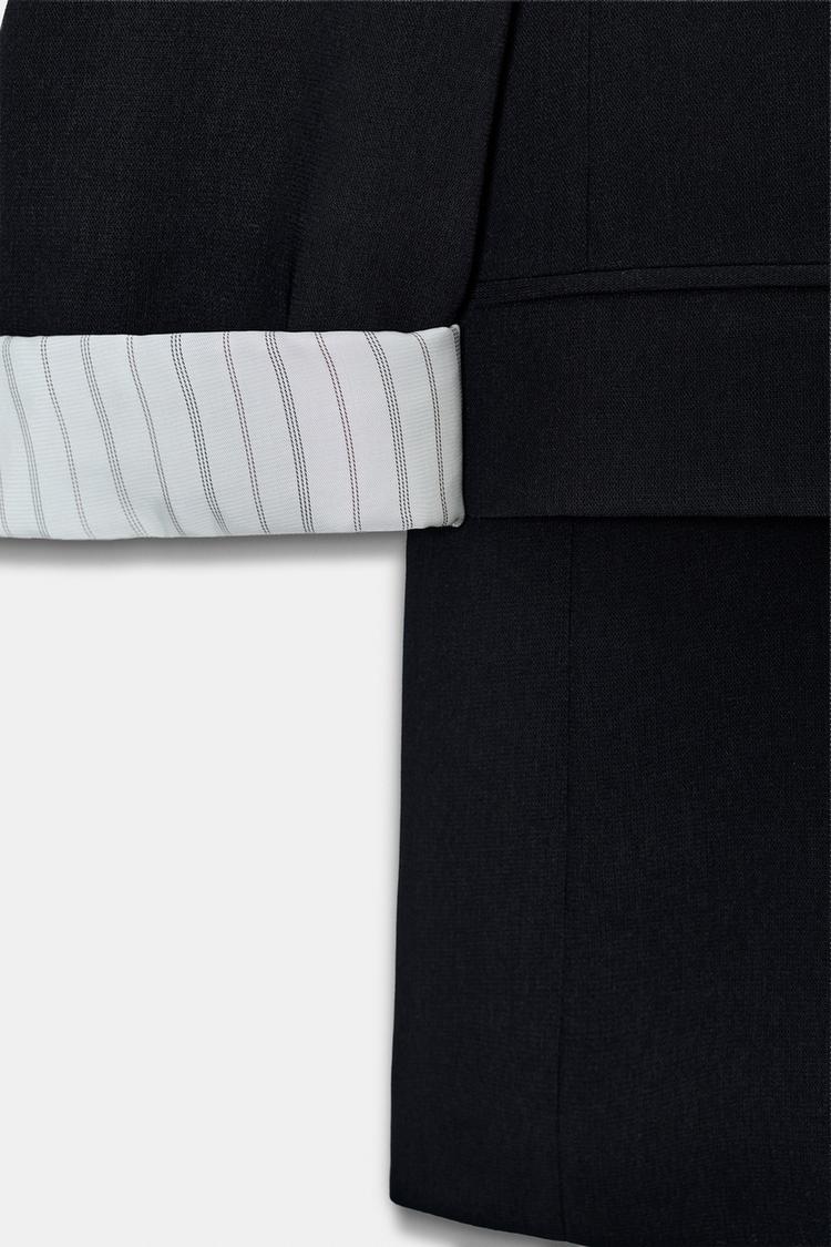 VESTE AVEC POIGNETS IMPRIMÉS
