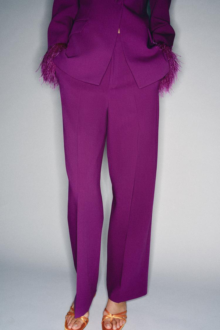 VESTE À ÉPAULETTES ET MANCHETTES EN PLUMES