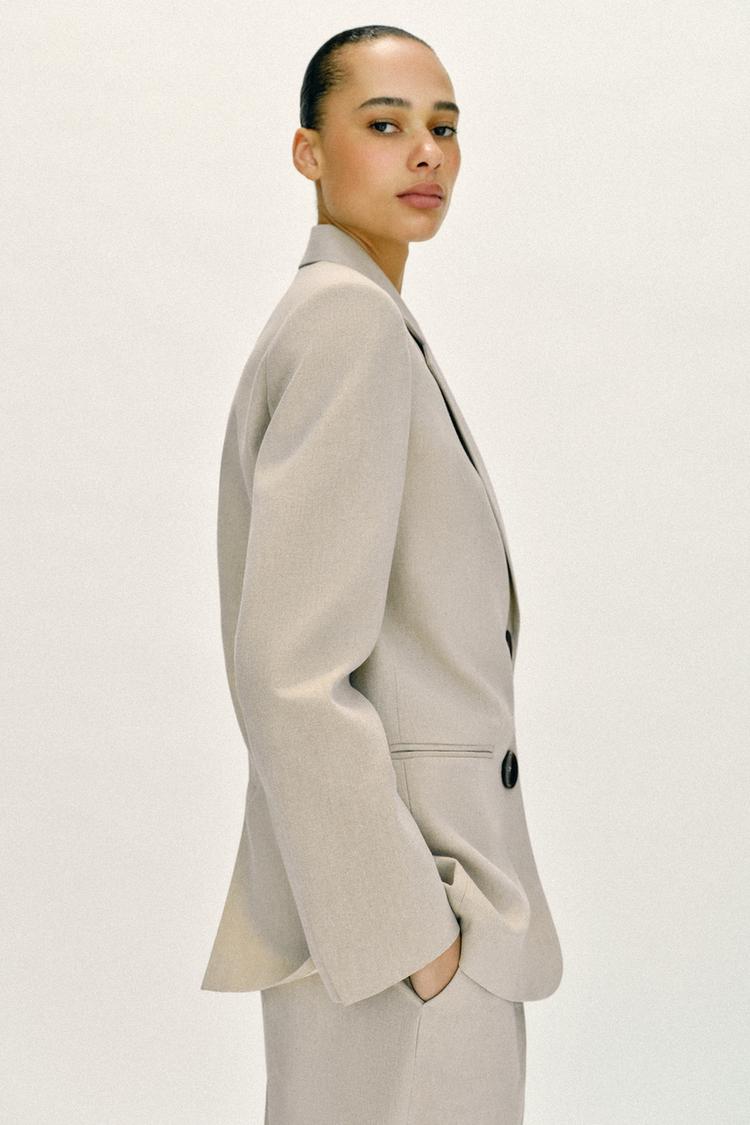 VESTE DROITE À ÉPAULETTES DEUX BOUTONS