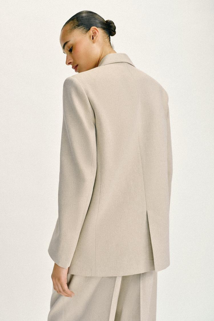 VESTE DROITE À ÉPAULETTES DEUX BOUTONS
