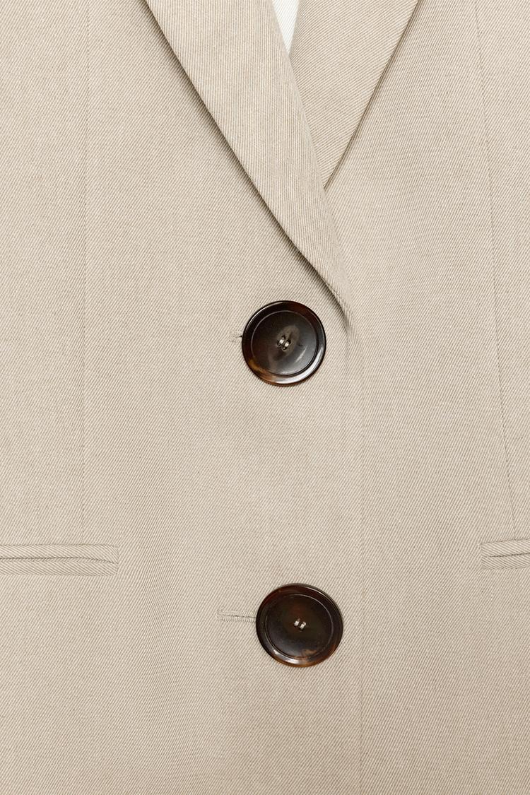 VESTE DROITE À ÉPAULETTES DEUX BOUTONS