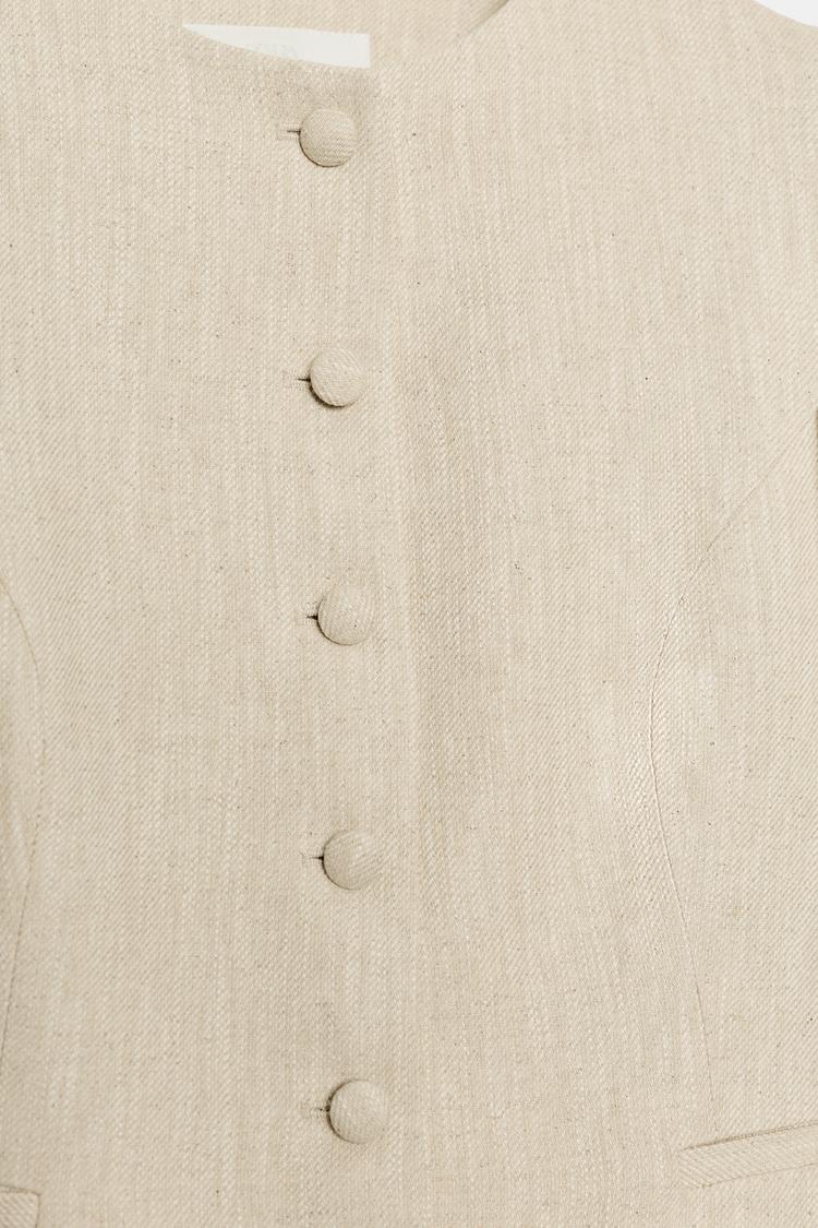 VESTE À MANCHES COURTES BOUFFANTES