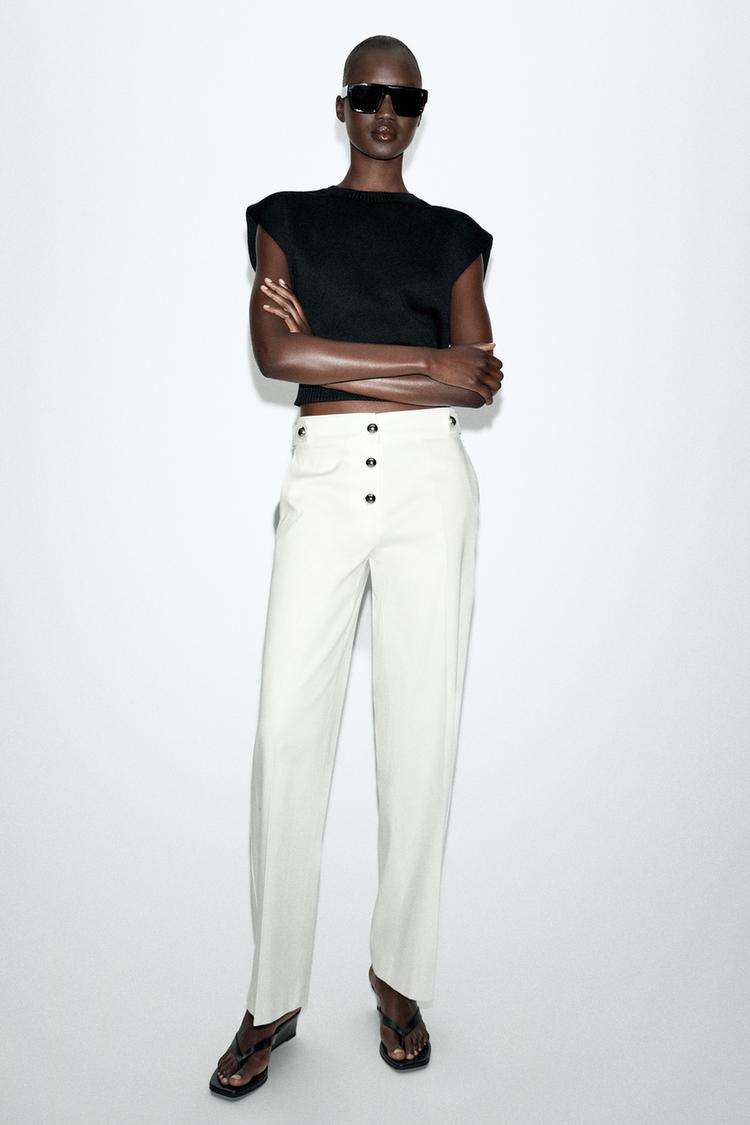 PANTALON À BOUTONS MÉTALLIQUES