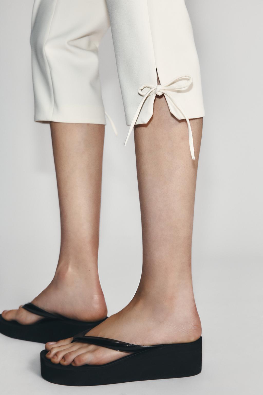 CAPRI TROUSERS WITH BOW HEM