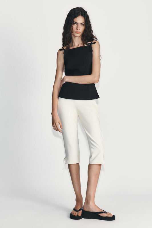 CAPRI TROUSERS WITH BOW HEM