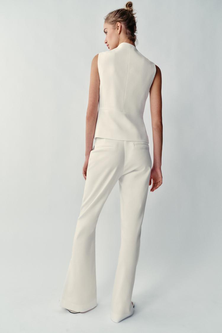 PANTALON À OUVERTURES SUR LE BAS