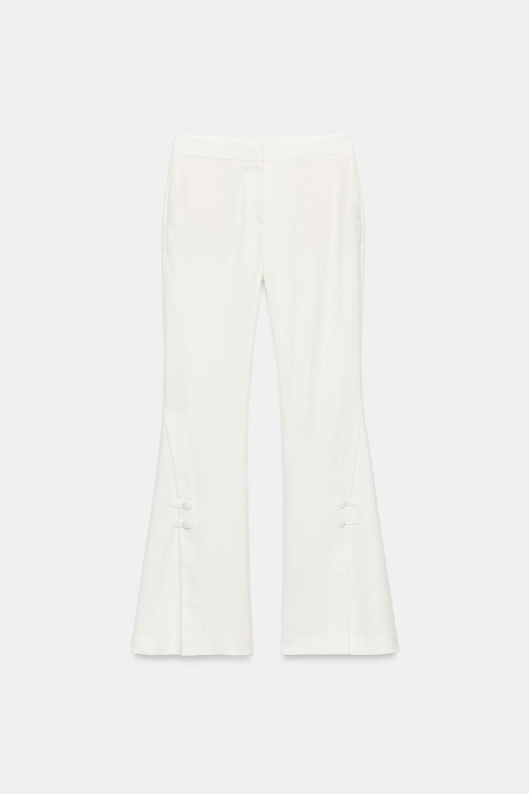 PANTALON À OUVERTURES SUR LE BAS
