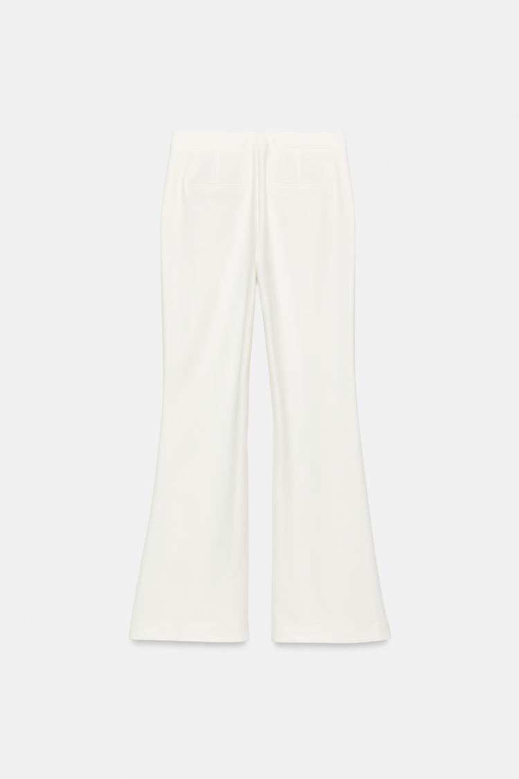 PANTALON À OUVERTURES SUR LE BAS