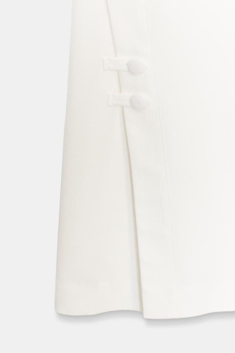 PANTALON À OUVERTURES SUR LE BAS