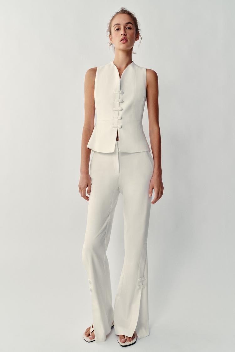PANTALON À OUVERTURES SUR LE BAS