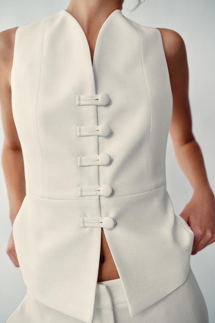 PANTALON À OUVERTURES SUR LE BAS