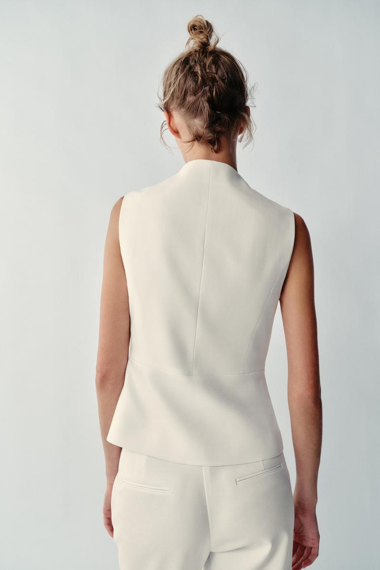 PANTALON À OUVERTURES SUR LE BAS
