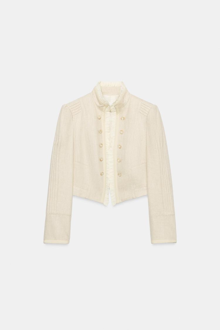 VESTE COURTE À VOLANTS