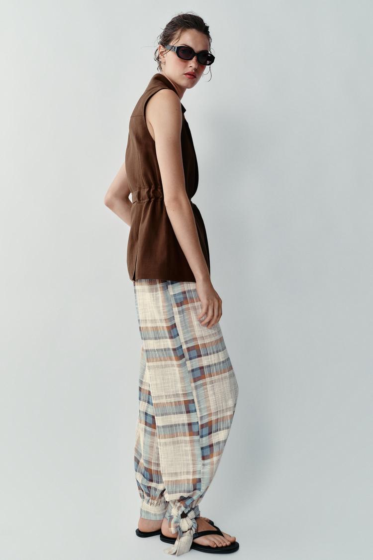 PANTALON BOUFFANT À LACETS ET CARREAUX