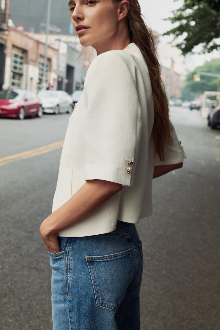 VESTE À MANCHES COURTES ET ÉPAULETTES