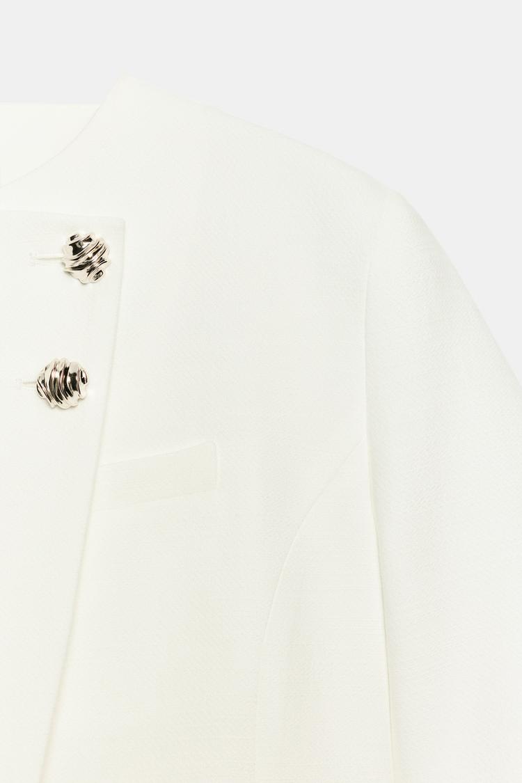 VESTE À MANCHES COURTES ET ÉPAULETTES