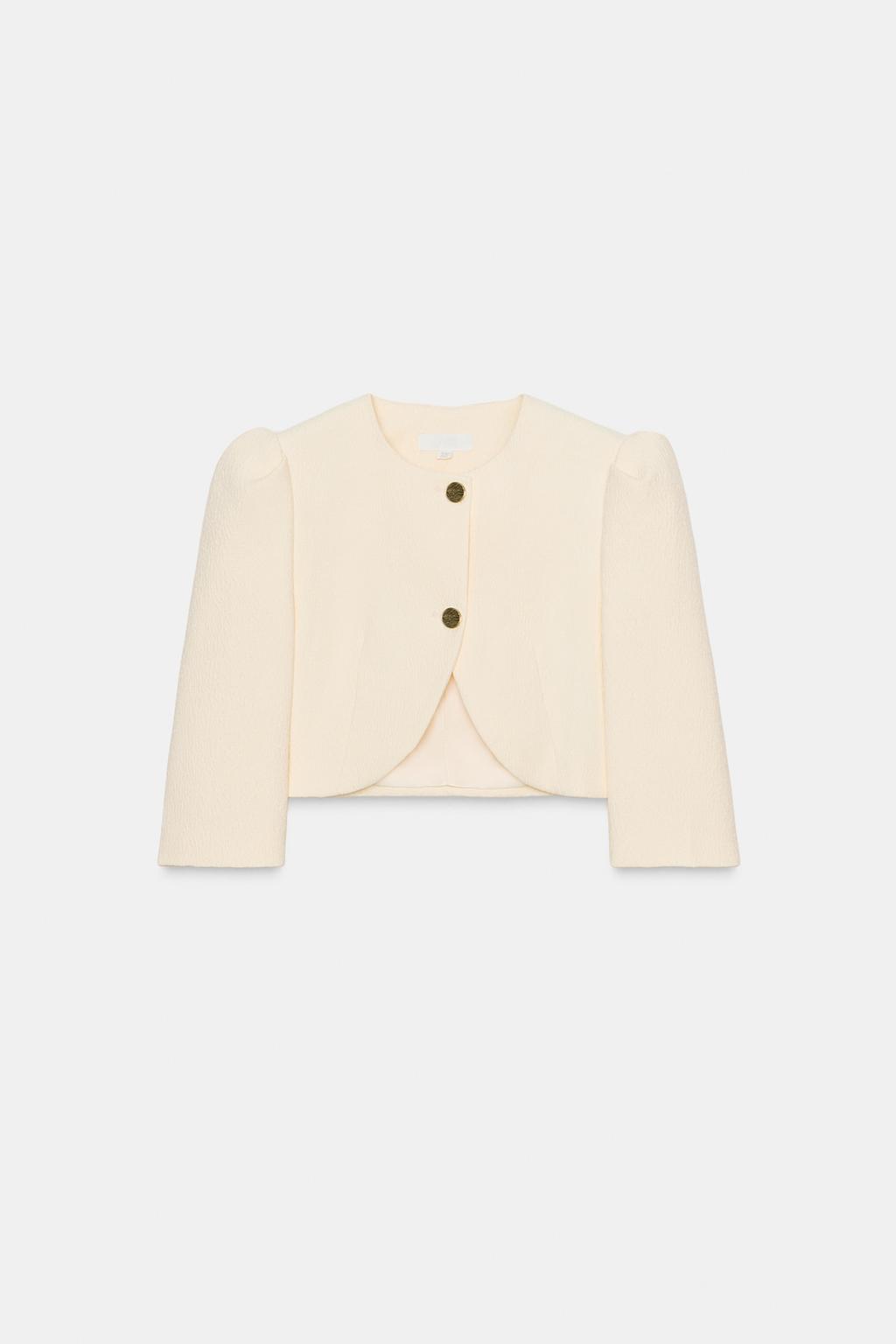 VESTE COURTE À MANCHES BOUFFANTES