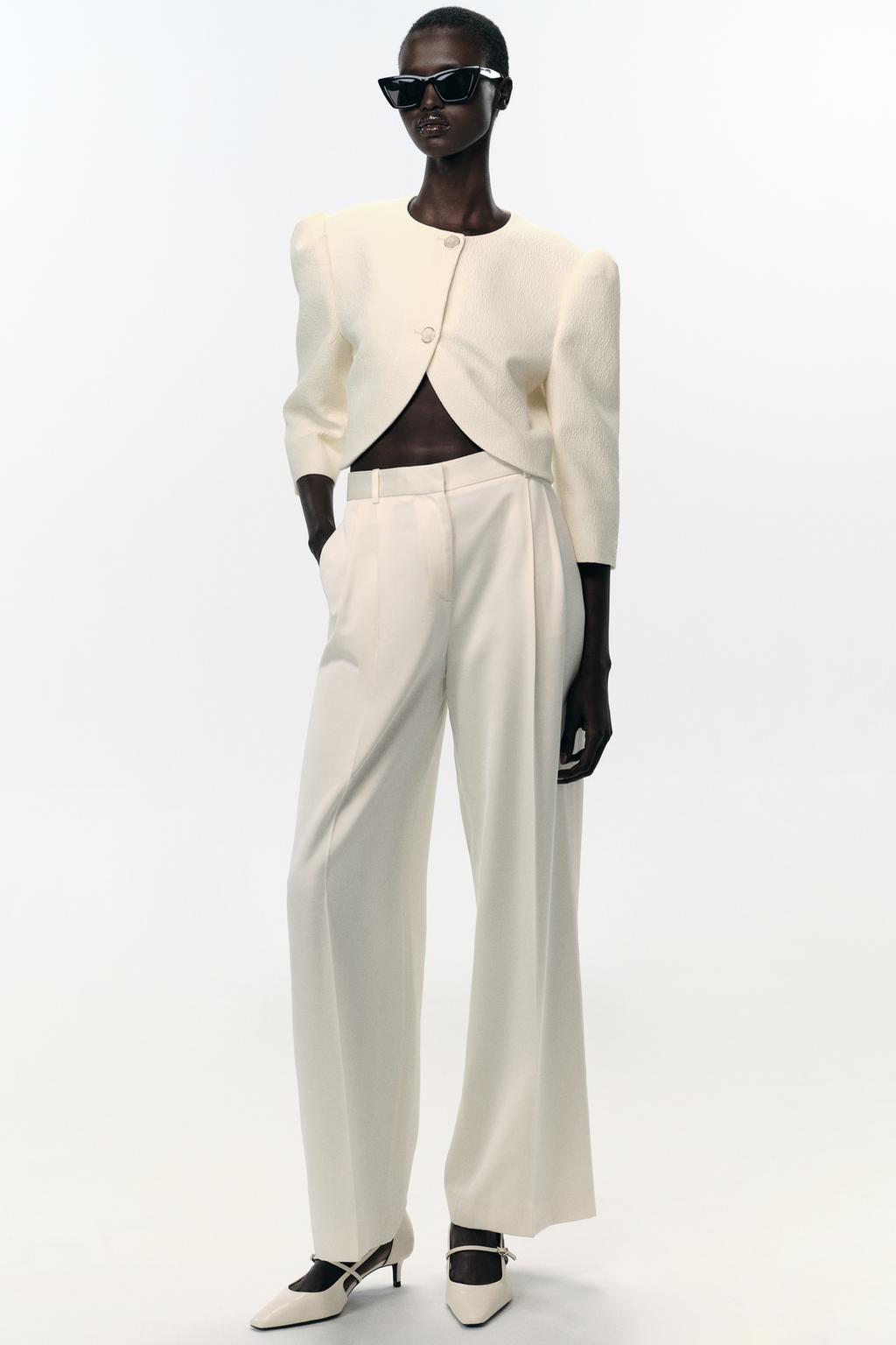 VESTE COURTE À MANCHES BOUFFANTES