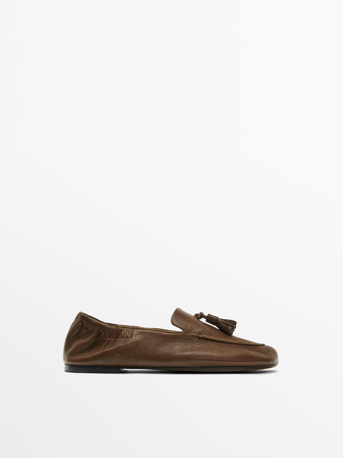 MOCASSINS EN CUIR À POMPONS