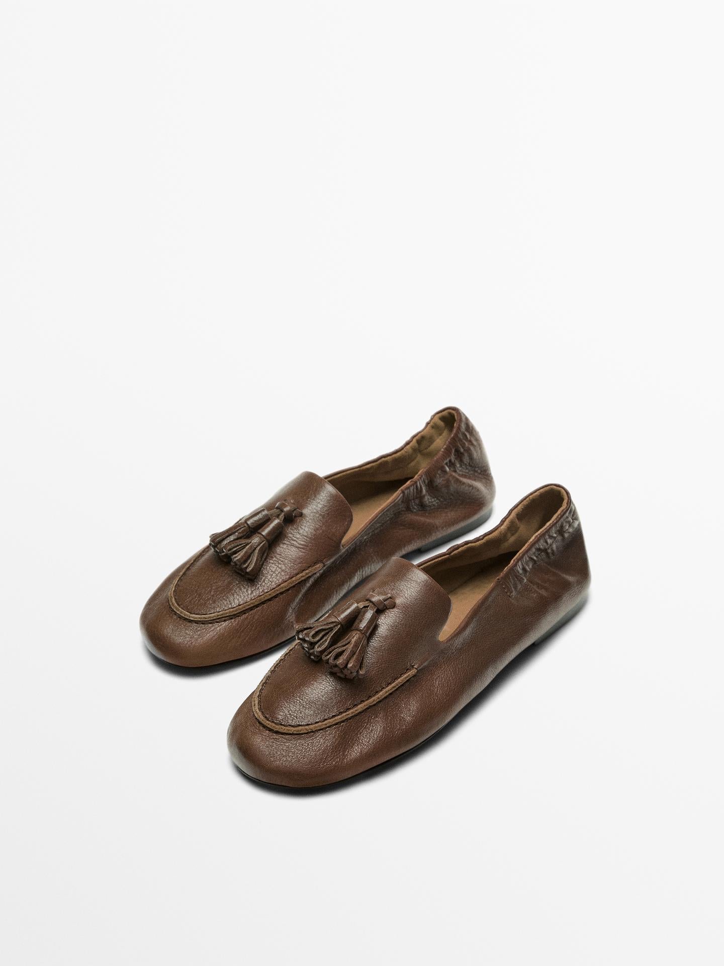 MOCASSINS EN CUIR À POMPONS