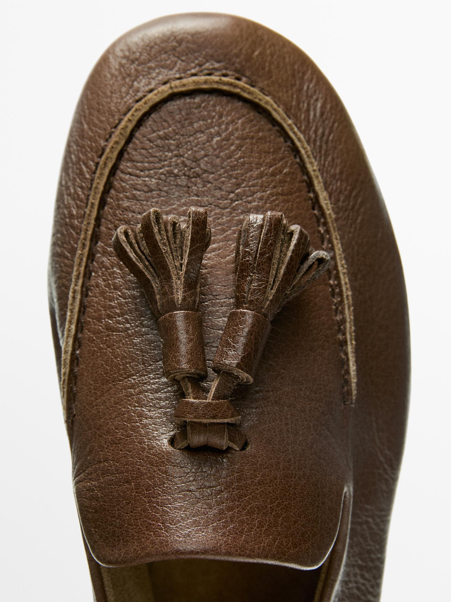 MOCASSINS EN CUIR À POMPONS