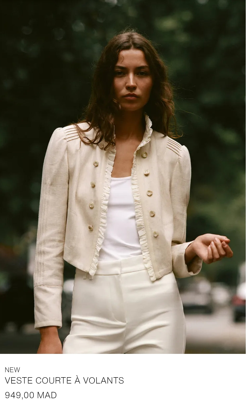 VESTE COURTE À VOLANTS