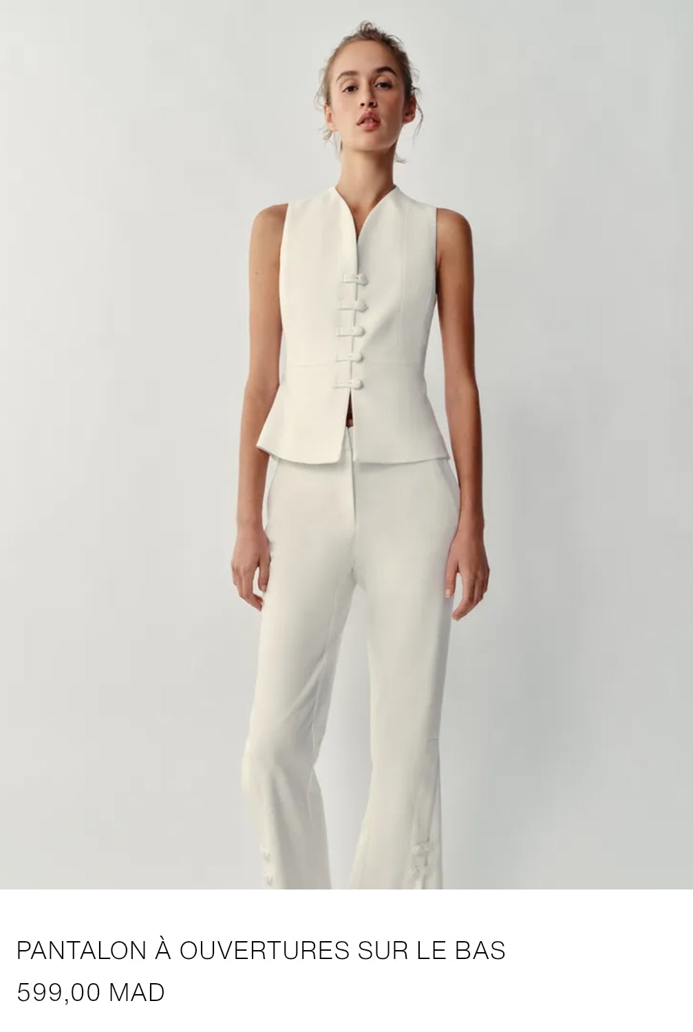 PANTALON À OUVERTURES SUR LE BAS