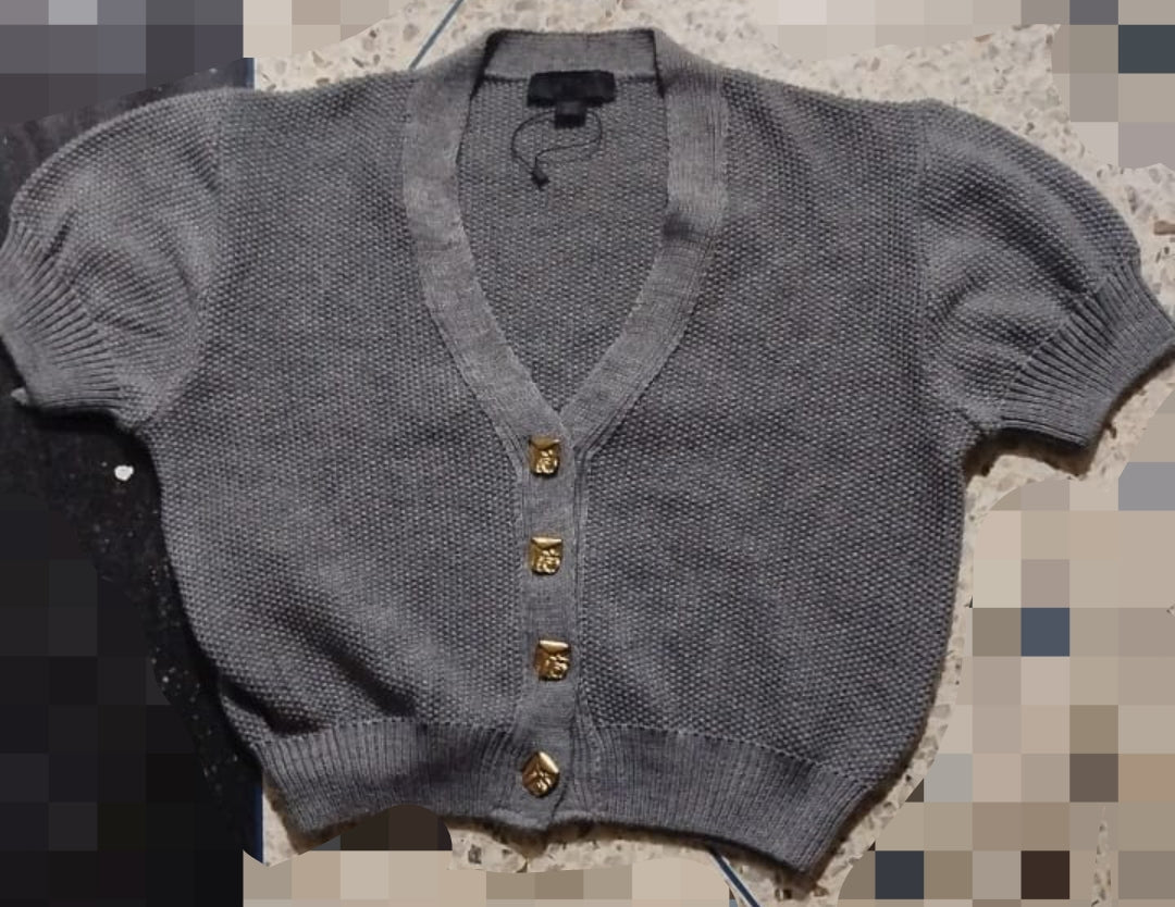 GILET EN MAILLE À MANCHES BOUFFANTES
