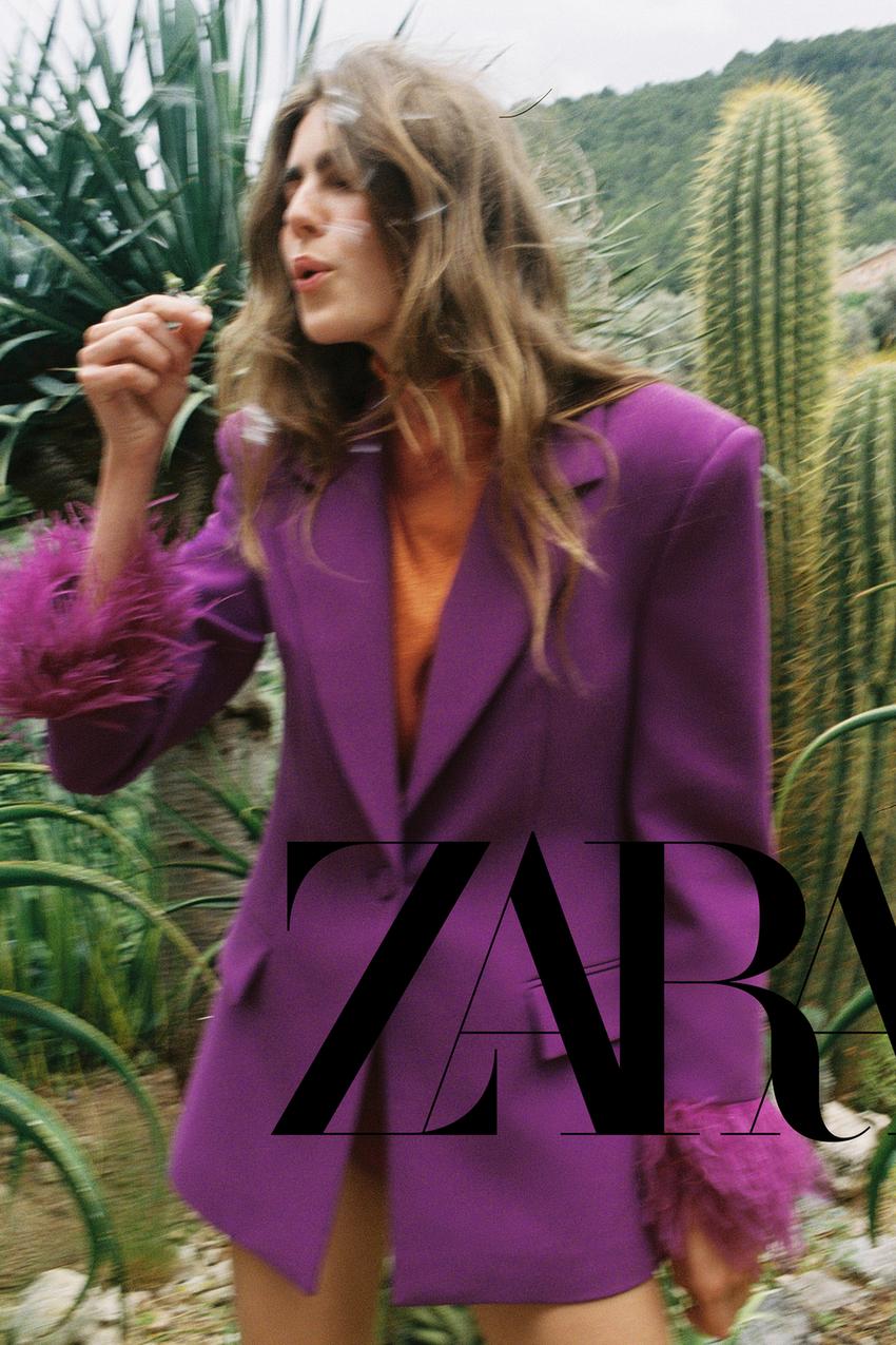 VESTE À ÉPAULETTES ET MANCHETTES EN PLUMES